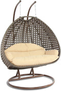 LeisureMod 2-Person Wicker Egg Chair, Hanging Swing Chair for Indoor & Outdoor Use with Cushions, Beige Steel Stand, UV-Resistant, Hammock Lounge Seat for Patio, Porch, or Bedroom (Cream)