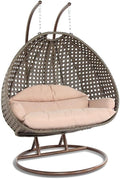 LeisureMod 2 Person Wicker Egg Chair Outdoor Indoor Bedroom Patio Hanging Lounge Swing Hammock Chairs with Beige Stand and UV Resistant Cushions (Beige)