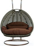 LeisureMod Brown Wicker 2 Person Egg Swing Chair with Beige Stand and Cushions – Double Hanging Hammock Lounge for Patio, Indoor & Outdoor Use