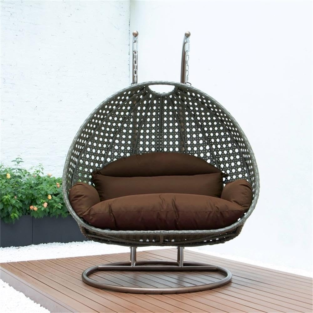 LeisureMod Brown Wicker 2 Person Egg Swing Chair with Beige Stand and Cushions – Double Hanging Hammock Lounge for Patio, Indoor & Outdoor Use