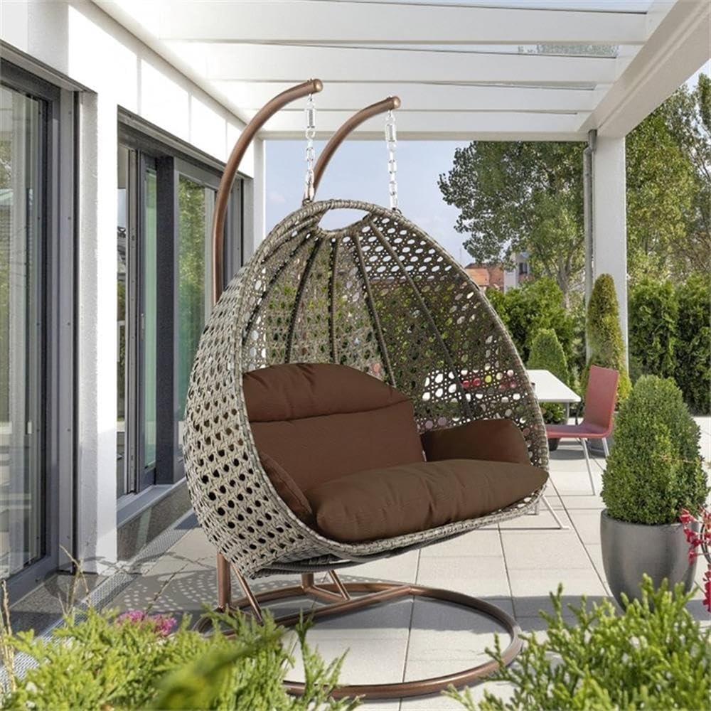 LeisureMod Brown Wicker 2 Person Egg Swing Chair with Beige Stand and Cushions – Double Hanging Hammock Lounge for Patio, Indoor & Outdoor Use