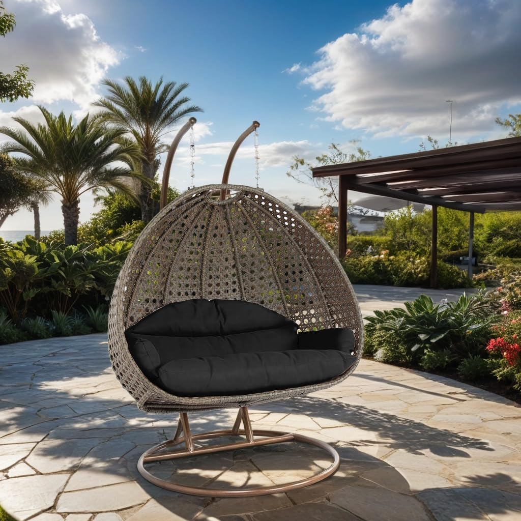 LeisureMod Black Wicker 2 Person Egg Swing Chair with Beige Stand and Cushions – Double Hanging Hammock Lounge for Patio, Indoor & Outdoor Use