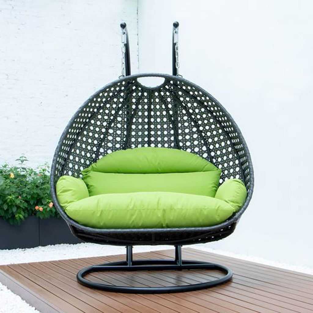 LeisureMod 2 Person Wicker Hanging Egg Chair, Indoor Outdoor Patio Swing with Black Stand & UV-Resistant Cushions, Lounge Chair for Bedroom & Garden, Light Green
