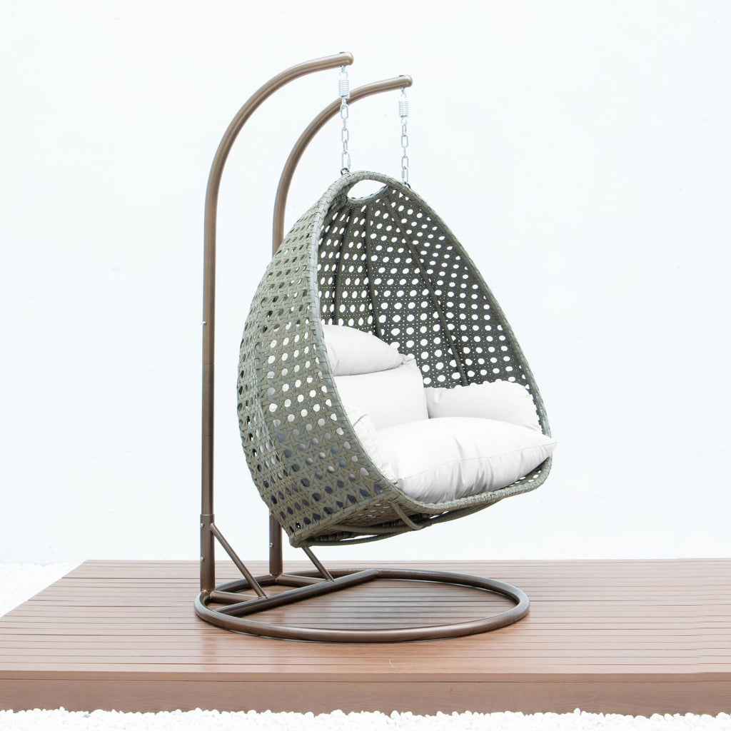 LeisureMod 2 Person Wicker Egg Chair Outdoor Indoor Bedroom Patio Hanging Lounge Swing Hammock Chairs with White Stand and UV Resistant Cushions (White)