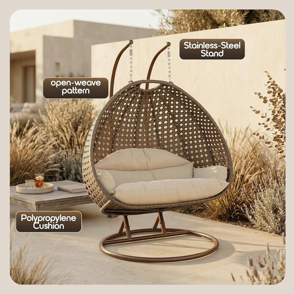 LeisureMod 2-Person Wicker Egg Chair, Hanging Swing Chair for Indoor & Outdoor Use with Cushions, Beige Steel Stand, UV-Resistant, Hammock Lounge Seat for Patio, Porch, or Bedroom (Cream)